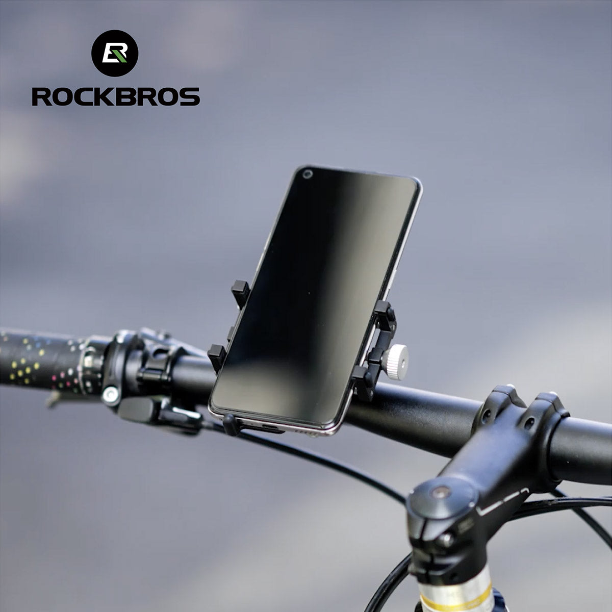 Stabile Smartphone-Halterung am Fahrradlenker mit Rändelschraube und rutschfesten Greifern, leicht und vibrationsfest.